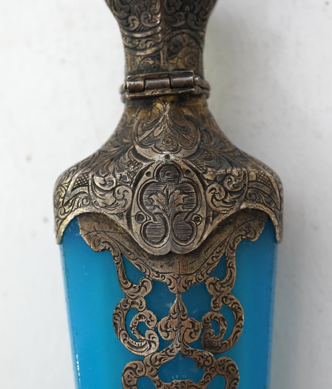 A late 19th century French white metal mounted and overlaid blue opaline glass scent flask